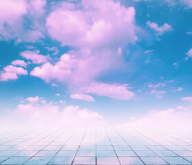 pink clouds, blue sky, gray floor.