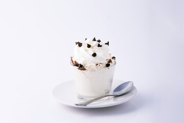 Whipping cream and chocolate chip in the transparent glass