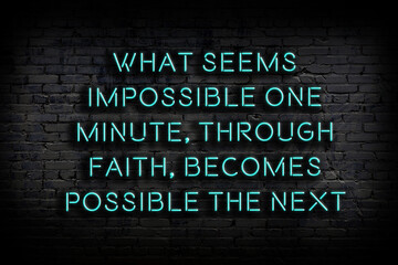 Wise quote. Neon inscription against brick wall