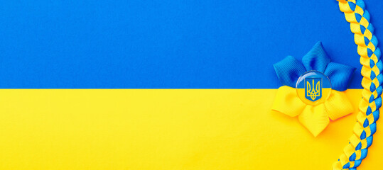 Ukraine flag symbol background. Ukrainian flower trident symbol isolated on yellow blue flag banner. Support Ukraine concept.