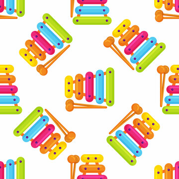 Kids toy xylophone seamless pattern, multicolored percussion musical instrument on background