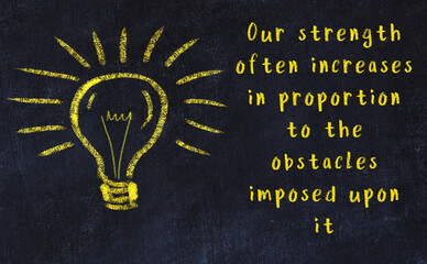 Chalk drawing of a bulb and inscription of wise quote