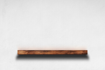 Wooden shelf on white concrete wall background for decorative design.