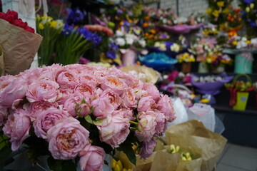 Bright bouquets of flowers with decorative paper on sale.