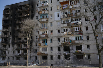A destroyed residential building in the city that was damaged by a shell explosion during the war in Ukraine. House without windows.