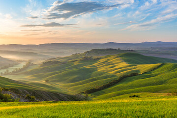Fototapeta premium Morning light with fog in Tuscany, Italy