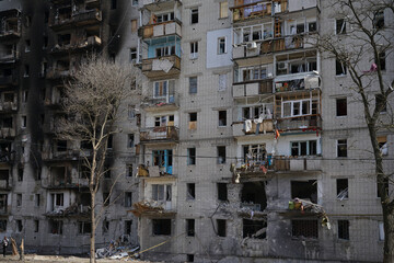 A destroyed residential building in the city that was damaged by a shell explosion during the war in Ukraine. House without windows.