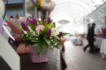 Bright bouquets of flowers with decorative paper on sale.