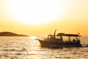 Fototapeta premium Yacht at sunset in a sea. Soft light.