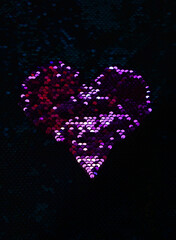 Dark pink heart on a dark background of sequins. Bright pink heart on a dark green background.