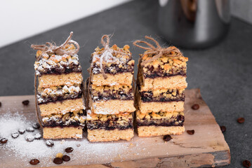 Homemade baking. Sprinkle cookies with coffee beans with powdered sugar. On a gray background.