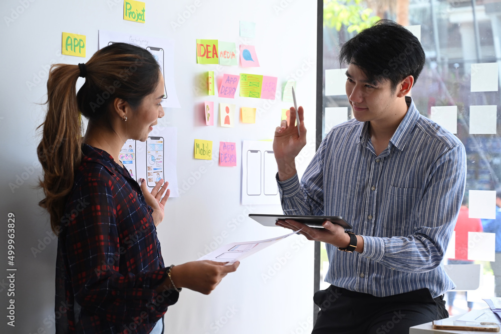 Poster user experience designers are discussing and planning sketch, prototype, framework, layout app desig