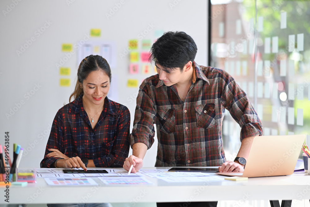 Poster shot of website developer team planning application development for mobile phone at creative workpla