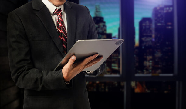 Close up image of business man holding a digital tablet online banking, internet network communication concept.