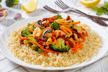 quinoa with fried veggies, mushrooms on plate