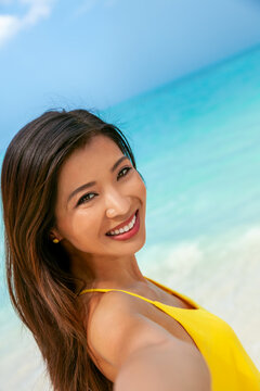 Beautiful Asian Female Smiling Taking Selfie By Ocean