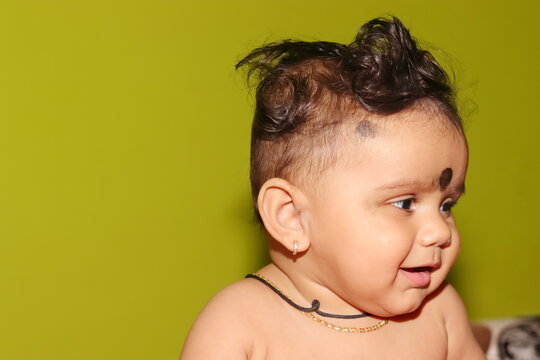 portrait photo of A lovely cute little Indian hindu baby boy without clothes with smiling face, india