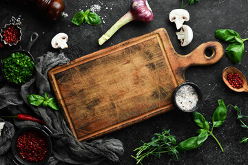 Food background. Spices, herbs and kitchen tools. Top view. free space for your text. Rustic style.