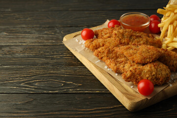 Concept of tasty food with chicken strips, space for text