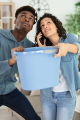 desperate couple callling to insurance worried about home leaks