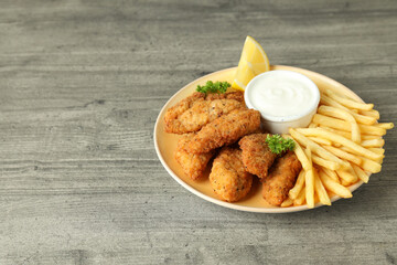 Concept of tasty food with chicken strips, space for text