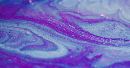 Color fluid mix. Glitter ink wave. Marble pattern. Blur fluorescent purple pink blue oil paint...