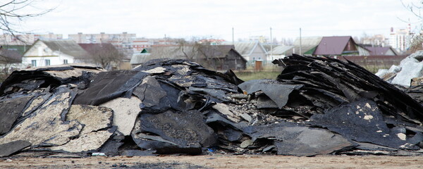 Old bitumen roofing material Industrial garbage pile