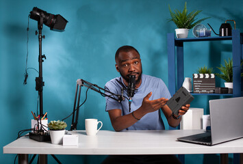 Digital technology social media channel reviewer presenting the benefits of using v mount...