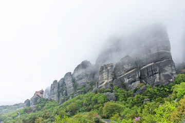 Fototapeta premium Meteora mountains in Greece during rain, cloudy sky