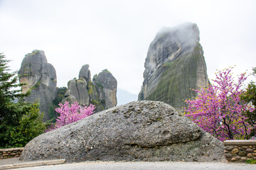 Meteora mountains in Greece during rain, cloudy sky