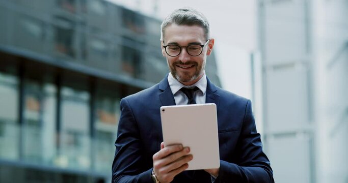 Technology lets me work from anywhere. Handsome young businessman standing outside alone and using a tablet. Business man using a smart device while taking a break outside 