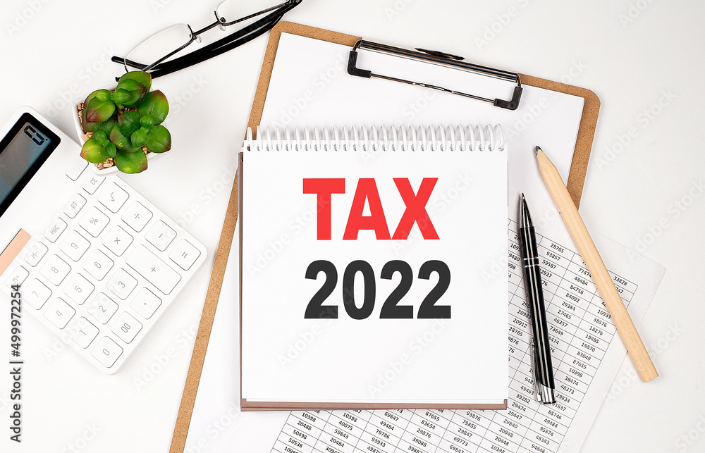 Poster office desk table with paper sheet, notepad ,chart and calculator. top view tax 2022