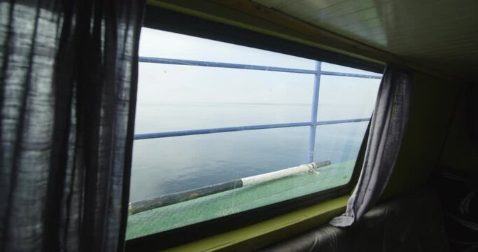 View of the Curonian Lagoon through the lower window of the boat 4K DCI 25fps