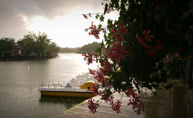 Rainy afternoon at the harbour of Gura Portitei Black Sea resort in Romania. Amazing landscape from Danube Delta. Rain through the rays of sun.