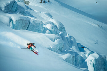 Freeride skier skiing down a slope in Chamonix France 