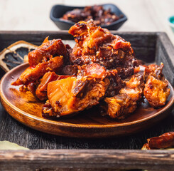 Rabbit meat on a wooden plate
