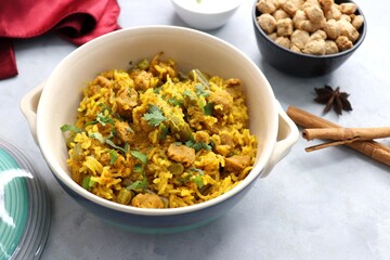Soya chunks Biryani. Basmati rice cooked with Soyabean or Soya vadi along with spices and vegetables. It's a complete protein rich and nutritious one pot meal. Copy space