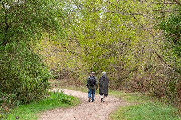 Retired couple walking through Réserve Naturelle Nationale du Marais d'Orx