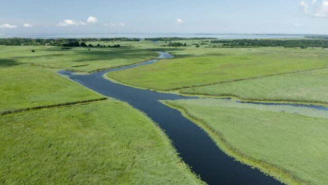 Aerial shot of amazing Lithuanian meadows. Rusnė city. &Scaron;ilutė. 4K 25fps