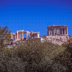 Parthenon ancient temple on Acropolis of Athens Greece, under clear blue sky, with space for your text or logo.