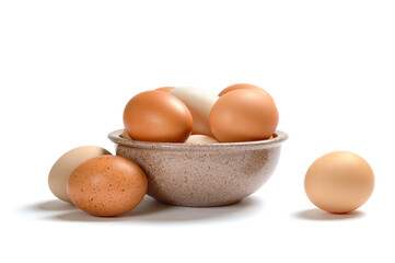 Many farm chicken eggs in a bowl on a white background. Concept of eco products