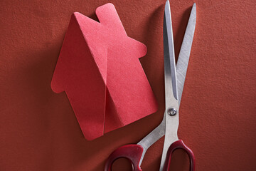 red paper model house cut in half