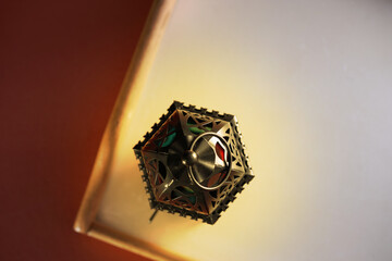 top view of arabic lantern on white tray