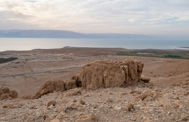 View  from a mountain near the Tamarim stream on the Israeli side of the Dead Sea at sunrise over the Dead Sea and over the mountains on the Jordan side near Jerusalem in Israel