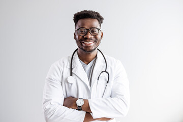 Portrait of confident black doctor. Smiling african american doctor with stethoscope at medical clinic. Happy healthcare worker at modern hospital. Portrait of happy african doctor at private clinic