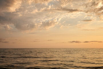 Sea and sky with clouds at sunset