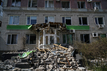 Facade of a destroyed building in Ukraine after a shell explosion.