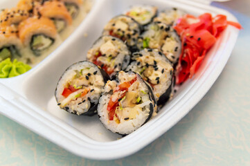 sushi from delivery in a disposable container