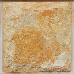 Natural stone wall background  texture in yellow and beige colors . Close up photo .