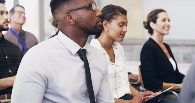 Theres so many potential benefits of attending a conference. 4k footage of a group of businesspeople attending a conference.